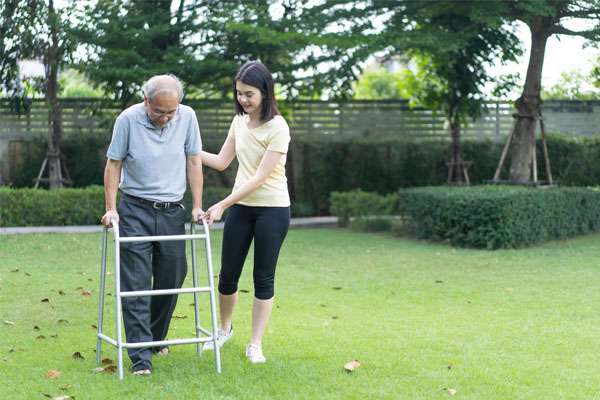 Asian girl daughter take care of disabled senior grandfather in disability support services Melbourne